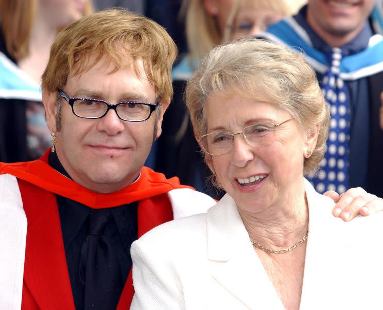 Sir Elton John with his mother, smiles after receiving an Honorary Doctorate from the Royal Academy of Music outside the Royal Academy of Music in London. (PA)