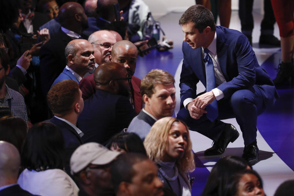 Democratic presidential candidates, former South Bend Mayor Pete Buttigieg, speak with member of the audience after participating in a Democratic presidential primary debate at the Gaillard Center, Tuesday, Feb. 25, 2020, in Charleston, S.C., co-hosted by CBS News and the Congressional Black Caucus Institute. (AP Photo/Patrick Semansky)