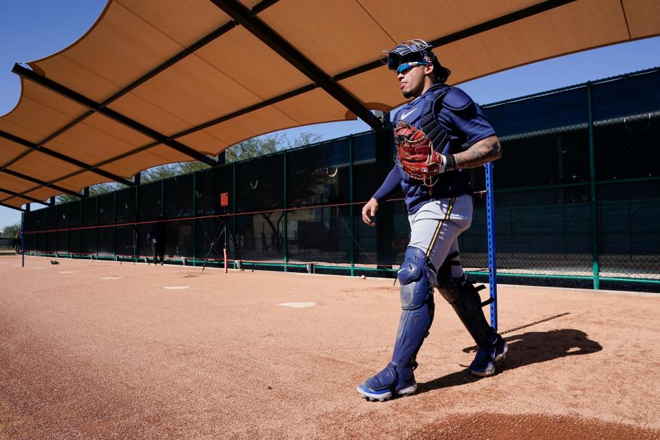 Milwaukee Brewers' William Contreras walks after catching during a spring training baseball workout Thursday, Feb. 16, 2023, in Phoenix. (AP Photo/Morry Gash)