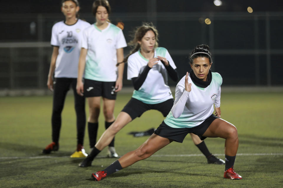 Players of the Orthodox Club's women's team practice in Amman, Jordan, Saturday, Oct. 22, 2022. Women's soccer has been long been neglected in the Middle East, a region that is mad for the men's game and hosts the World Cup for the first time this month in Qatar. (AP Photo/Raad AL-Adayleh)