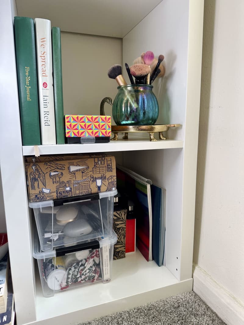 Clear storage bin in a cabinet.