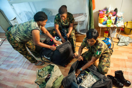 FILE PHOTO - Group of female United Nations military roommates from Nigeria posted in Monrovia, pack their belongings at their base, as their departure approaches, Liberia January 12, 2018. Albert Gonzalez Farran/UNMIL/Handout via REUTERS