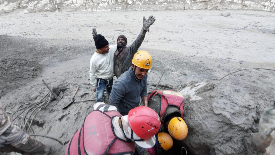 This photo provided by Indo Tibetan Border Police (ITBP) shows a man reacting after he was pulled out from beneath the ground during rescue efforts: Source: AP