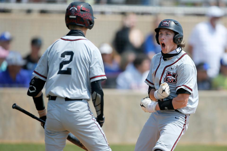 Mustang's Graham Hylton celebrates after scoring a run during a Class 6A semifinal against Deer Creek on Friday in Edmond.