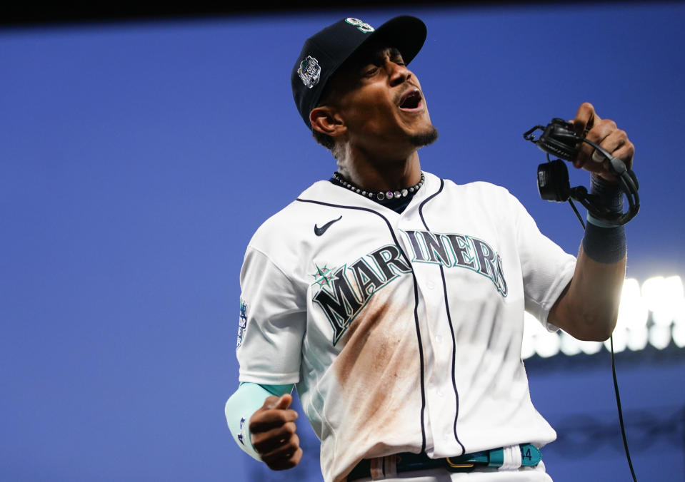 Seattle Mariners center fielder Julio Rodriguez reacts after a postgame interview following an 8-4 win against the Washington Nationals in a baseball game Monday, June 26, 2023, in Seattle. (AP Photo/Lindsey Wasson)