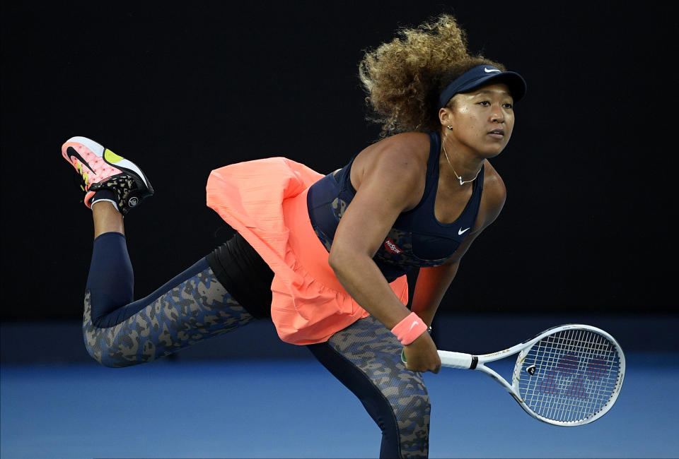 FILE - Japan's Naomi Osaka serves to United States' Jennifer Brady during the women's singles final at the Australian Open tennis championship in Melbourne, Australia, in this Saturday, Feb. 20, 2021, file photo. Osaka withdrew from the French Open after being fined and publicly reprimanded. She sat out Wimbledon, too. So the Tokyo Games mark her return to competition — and it's an occasion that matters to Osaka, who was born in Japan to a Japanese mother and Haitian father. (AP Photo/Andy Brownbill, File)