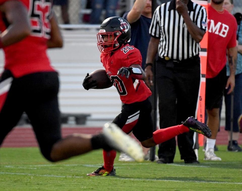 Bennett's Jamareon Stevens (20) rushes for a touchdown against Washington Thursday, Sept. 7, 2023, at Wicomico County Stadium in Salisbury, Maryland. Bennett defeated Washington 32-0.