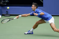 Novak Djokovic, of Serbia, returns a shot to Kyle Edmund, of Great Britain, during the second round of the US Open tennis championships, Wednesday, Sept. 2, 2020, in New York. (AP Photo/Seth Wenig)