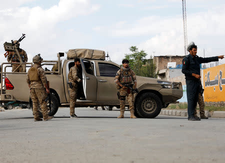 Afghan security forces keep watch outside a mosque after a blast in Kabul, Afghanistan May 24, 2019. REUTERS/Omar Sobhani