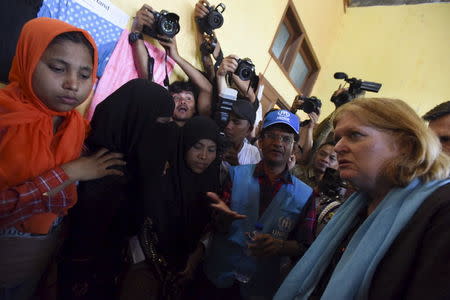 U.S. Assistant Secretary of State for Population, Refugees, and Migration Anne C. Richard (R) visits with Rohingya migrants at a temporary shelter in Kuala Cangkoi, Lhoksukon, Aceh province, Indonesia June 2, 2015 in this photo taken by Antara Foto. REUTERS/Zabur Karuru/Antara Foto