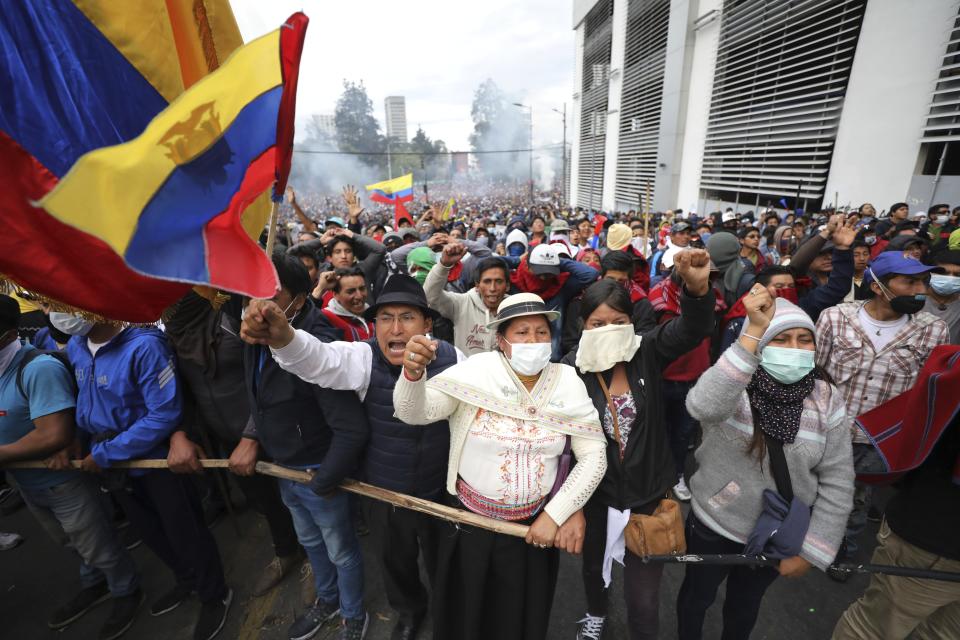 Anti-government demonstrators chant slogans against President Lenin Moreno and his economic policies during a protest in Quito, Ecuador, Tuesday, Oct. 8, 2019. The protests, which began when Moreno’s decision to cut subsidies led to a sharp increase in fuel prices, have persisted for days and clashes led the president to move his besieged administration out of Quito. (AP Photo/Fernando Vergara)