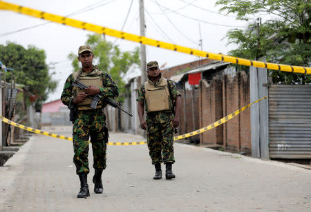 Security personnel at the site of an overnight gun battle, between troops and suspected Islamist militants, on the east coast of Sri Lanka, in Kalmunai, April 27, 2019. REUTERS/Dinuka Liyanawatte