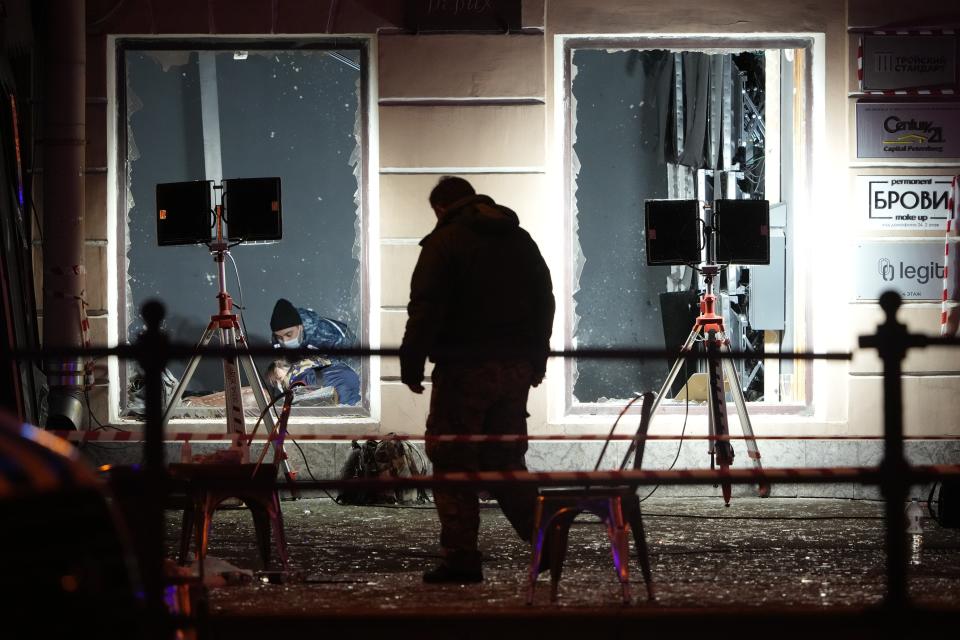 Russian investigators work at the site of an explosion at a cafe in St. Petersburg, Russia, Sunday, April 2, 2023. An explosion tore through a cafe in the Russian city of St. Petersburg on Sunday, and preliminary reports suggested a prominent military blogger was killed and more than a dozen people were injured. (AP Photo)