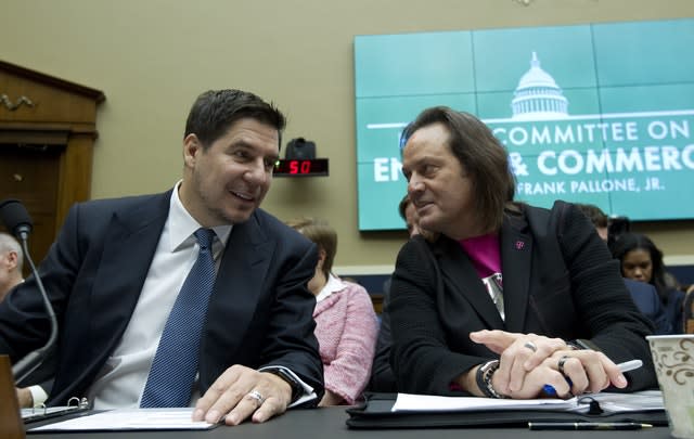 Sprint executive chairman Marcelo Claure, left, swith T-Mobile US chief executive and president John Legere 