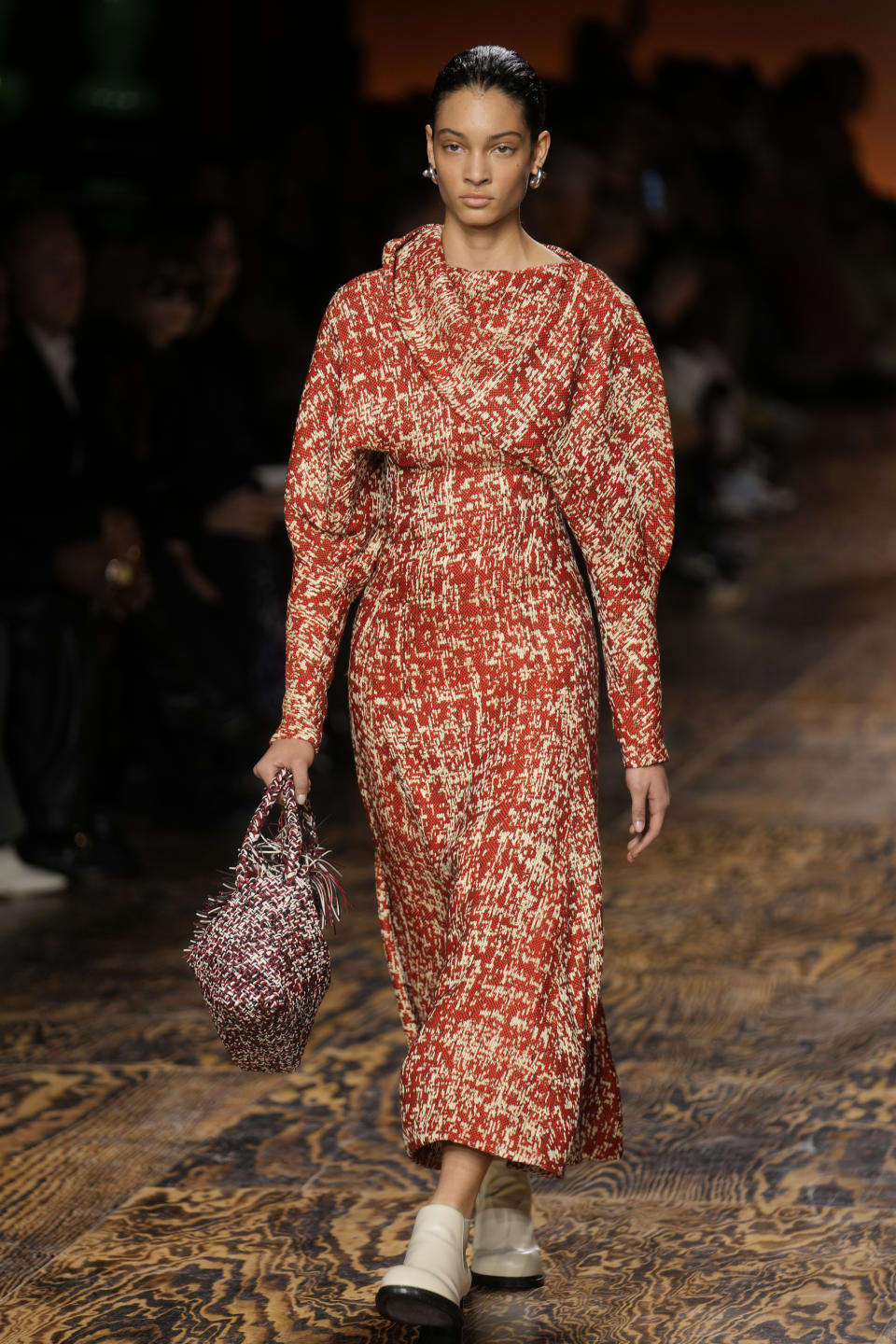 A model wears a creation as part of the Bottega Veneta women's Fall-Winter 2024-25 collection presented in Milan, Italy, Saturday, Feb. 24, 2024. (AP Photo/Luca Bruno)