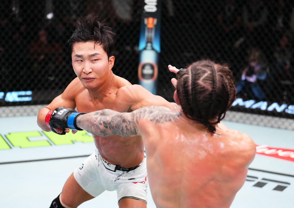 LAS VEGAS, NEVADA – FEBRUARY 03: (L-R) JeongYeong Lee of South Korea punches Blake Bilder in a featherweight fight during the UFC Fight Night event at UFC APEX on February 03, 2024 in Las Vegas, Nevada. (Photo by Chris Unger/Zuffa LLC via Getty Images)