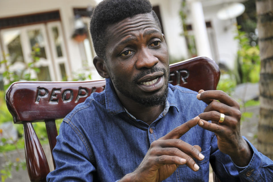 In this photo taken Friday, March 27, 2020, Ugandan musician, lawmaker and presidential aspirant Bobi Wine, whose real name is Kyagulanyi Ssentamu, speaks to The Associated Press in Kampala, Uganda. Wine, who released a song in March 2020 urging Africa's people to wash their hands to stop the spread of the new coronavirus, is criticizing African governments for not maintaining better health care systems for the continent's 1.3 billion people while investing in weapons and "curtailing the voices of the people". (AP Photo/Ronald Kabuubi)