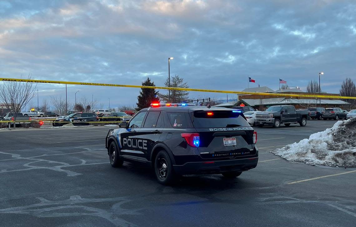 Police tape surrounds much of the parking lot behind the Texas Roadhouse restaurant on Fairview Avenue at the Meridian Crossroads mall.