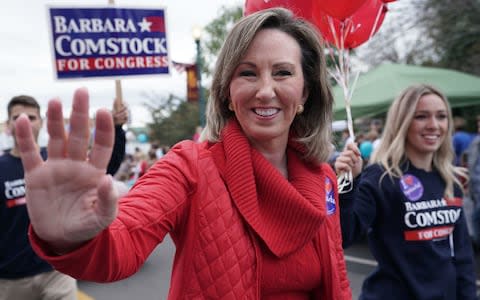 Republican Barbara Comstock waves to constituents during the annual Haymarket Day parade in Haymarket, Virginia - Credit: Alex Wong/Getty