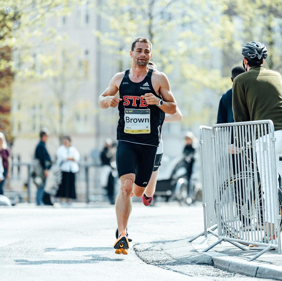 a runner rounds a corner during a marathon