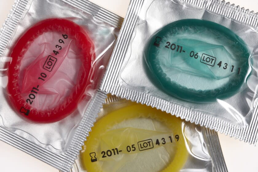 Colorful condoms are seen in sealed wrappers. <span class="copyright">(Westend61 / Getty Images)</span>