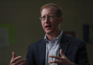 In this Tuesday, Sept. 24, 2019 photo, Jonathan Hayes, director of the Department of Health and Human Service’s Office of Refugee Resettlement, speaks during an interview in Lake Worth, Fla. Trump administration officials say Comprehensive Health Services, Inc., is keeping the Homestead, Fla., shelter on standby in case they need to quickly provide beds for more teens, and that they’re focused on the quality of care contractors can provide, not about who profits from the work. “It’s not something that sits with me morally as a problem,” said Hayes. “They’re not getting any additional money other than the normal grant or contract that would be received. We’re not paying them more just because they’re for profit.” (AP Photo/Wilfredo Lee)