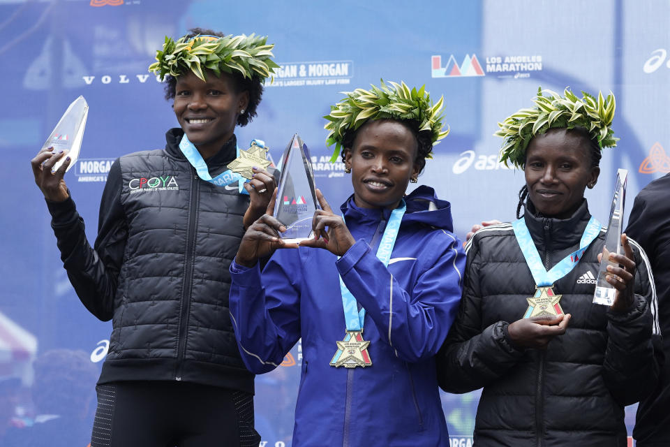 Marathon runners from Kenya, from left: Grace Kahura, Martha Akeno, and Stacy Ndiwa, the winnners of the Los Angeles Marathon women's elite pose for a picture in Los Angeles, on Sunday, March 19, 2023. (AP Photo/Damian Dovarganes)