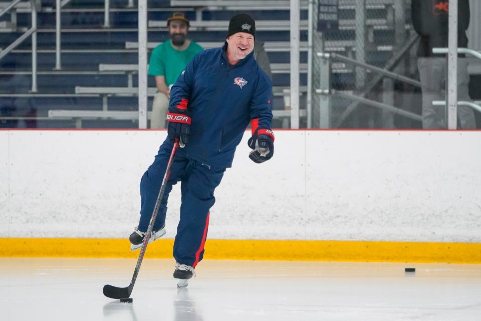 Jul. 12, 2022; Lewis Center, OH USA;  Columbus Blue Jackets goaltending coach Manny Legace laughs and skates with players during development camp at the OhioHealth Chiller North in Lewis Center on July 12, 2022. Mandatory Credit: Adam Cairns-The Columbus Dispatch