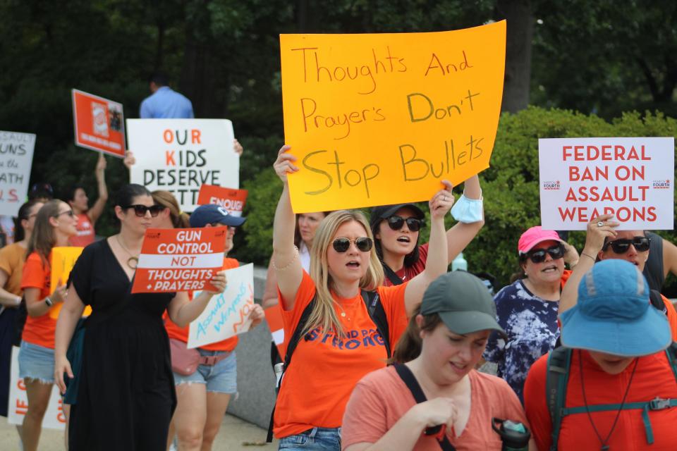 A group from Highland Park, Ill., rallies at the U.S. Capitol  July 13 to call for stronger gun control measures, including universal background checks and an assault weapons ban.