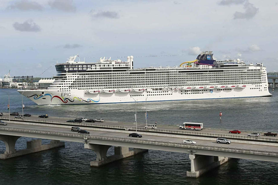 FILE - In this July 7, 2010, file photo, the Norwegian Epic, owned by the Norwegian Cruise Line Corporation, sails through the Government Cut to the Port of Miami in Miami. A federal judge on Sunday night, Aug. 8, 2021, granted Norwegian Cruise Line’s request to temporarily block a Florida law banning cruise companies from asking passengers for proof of coronavirus vaccination before they board a ship. U.S. District Judge Kathleen Williams granted the preliminary injunction in a lawsuit challenging the state’s “vaccine passport” ban, which was signed into law in May by Republican Gov. Ron DeSantis. (Pedro Portal/El Nuevo Herald via AP, File)