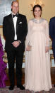 <p>To celebrate their first evening in Norway, the Duchess of Cambridge donned a cape gown by Alexander McQueen. She accessorised the look with jewels borrowed from Her Majesty and a sparkly Jimmy Choo clutch (which cost £1,142.85). <em>[Photo: Getty]</em> </p>