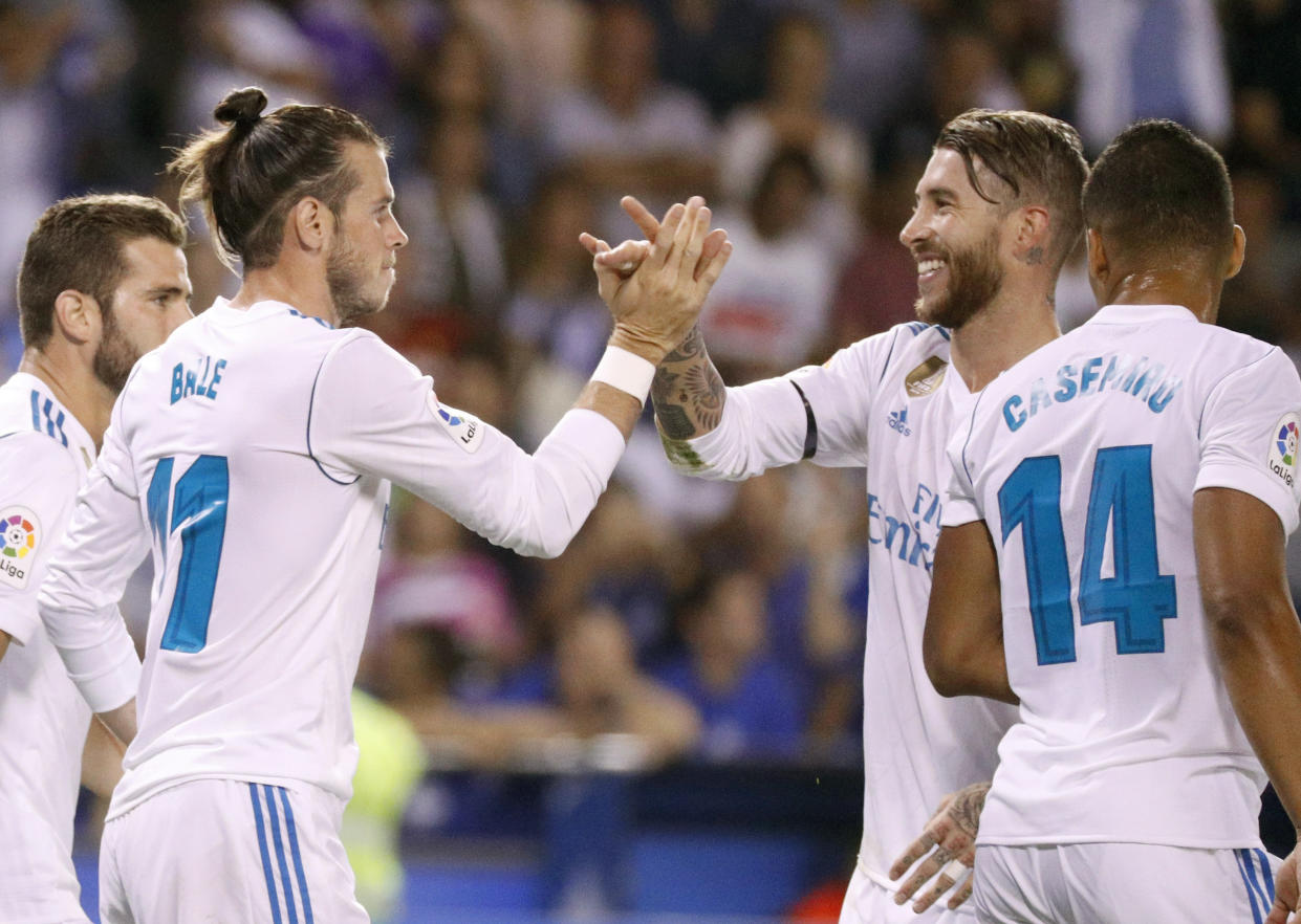 Gareth Bale (11) and Casemiro (14) scored two of three Real Madrid’s goals against Deportivo, while Sergio Ramos (second from right) earned one of his customary red cards. (EFE)