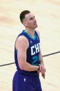 Charlotte Hornets forward Gordon Hayward (20) walks off the court after injuring his right wrist in the second half during an NBA basketball game against the Utah Jazz Monday, Feb. 22, 2021, in Salt Lake City. (AP Photo/Rick Bowmer)