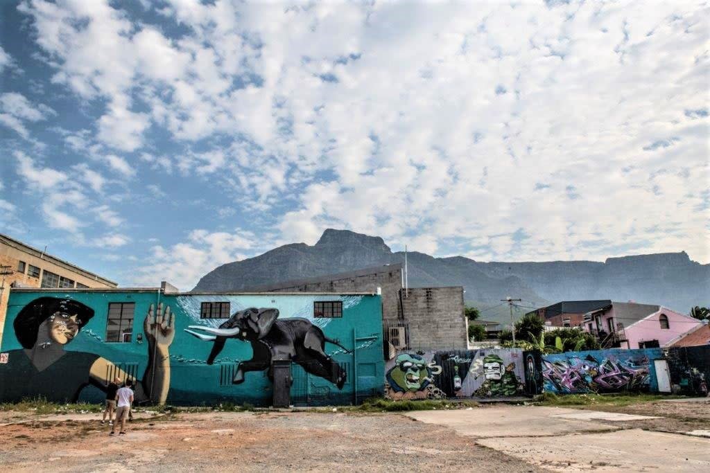 Guide Juma Mkwela with street art in Woodstock, Cape Town (South Africa Tourism)