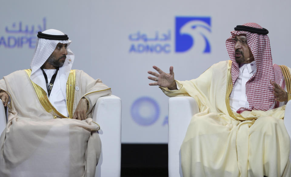 UAE Energy Minister Suhail al-Mazrouei, left, listens to Khalid Al-Falih, Saudi Energy and Oil Minister, in the opening ceremony of the Abu Dhabi International Exhibition & Conference, ADIPEC, in Abu Dhabi, United Arab Emirates, Monday, Nov.12, 2018. OPEC and allied oil-producing countries likely need to cut crude supplies to rebalance the market after proposed U.S. sanctions on Iran failed to cut Tehran's ouput, top Saudi and Emirati energy officials said Monday. (AP Photo/Kamran Jebreili)