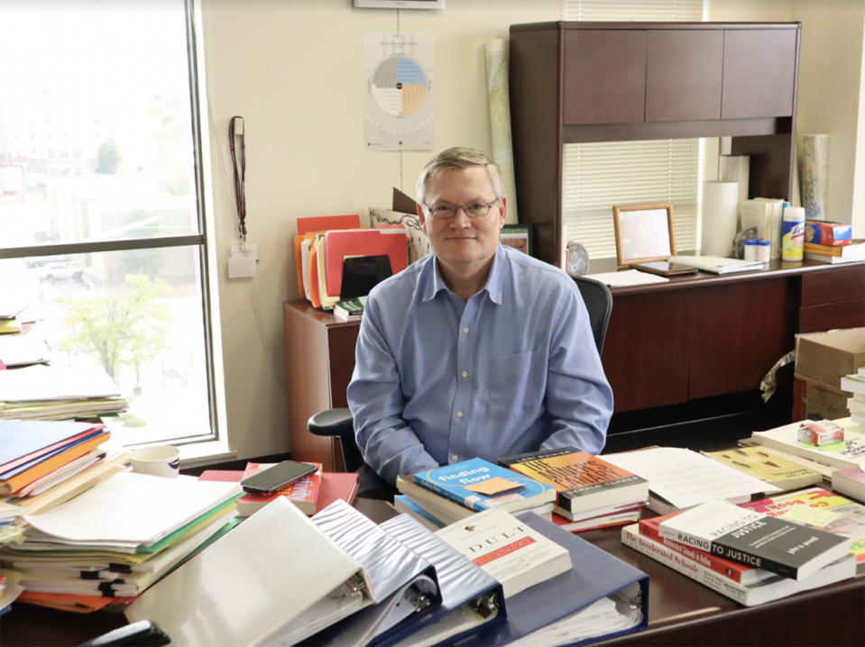 <em>Philip Farson, Albuquerque Public Schools Indian Education Department director, sits in his office. As a child, Farson lived in Tuba City, Ariz., on the Navajo Nation, for several years. The unequal treatment he saw his Diné and Hopi classmates receive in school inspired him to go into education. (Bella Davis</em>)