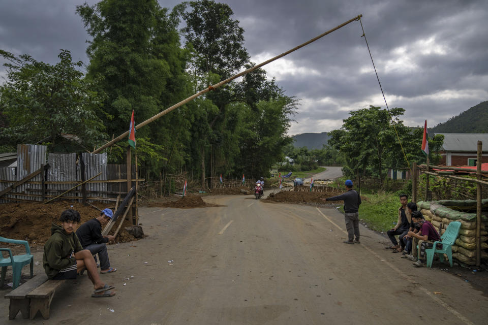 Tribal Kuki community volunteers man a checkpoint at a de facto frontline that dissects the area into two ethnic zones in Churachandpur, the northeastern Indian state of Manipur, Tuesday, June 20, 2023. Manipur is India’s unseen war – barely visible on the country’s countless TV news channels and newspapers, a conflict hidden behind the blanket shutdown of the internet that the government said was used to fuel the violence by spreading disinformation and rumors. (AP Photo/Altaf Qadri)