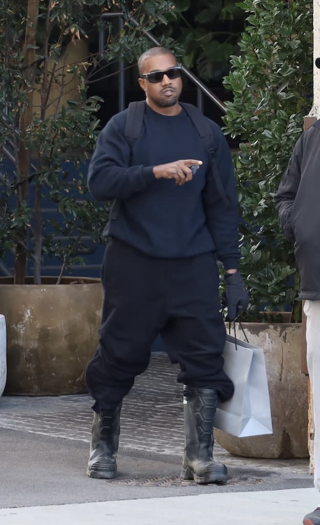 Kanye West leaving the SoHo Warehouse in Los Angeles on Jan. 14. - Credit: Khrome / SplashNews.com