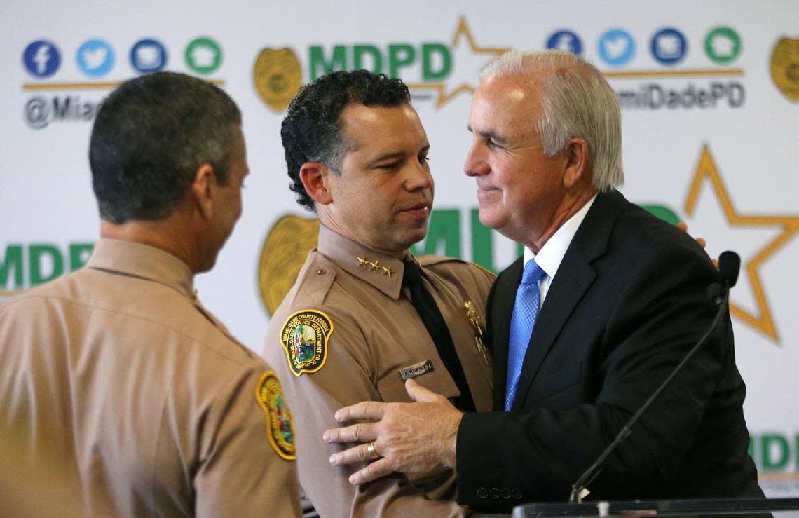 Then-Miami-Dade County Mayor Carlos A. Gimenez hugs the new director of the Miami-Dade Police Department Alfredo ‘Freddy’ Ramirez after a press conference at Miami-Dade Police Department Headquarters on Jan. 8, 2020, in Doral.