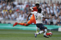 Newcastle's Joelinton, left, scores his side's first goal during the English Premier League soccer match between Tottenham Hotspur and Newcastle United at Tottenham Hotspur Stadium in London, Sunday, Aug. 25, 2019.(AP Photo/Frank Augstein)