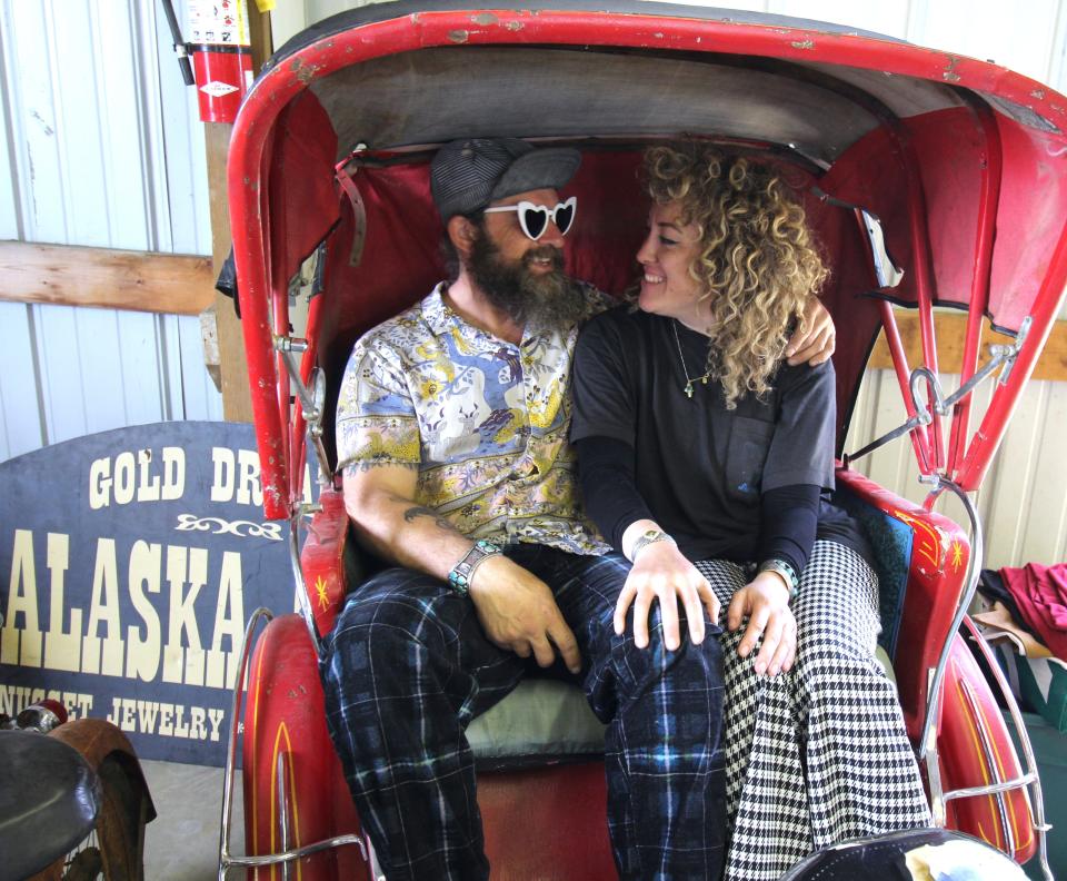 Nestled in a pedal taxi priced at $600, North Shore Cyclery owner Shawn Thelen (left) and Melissa Sietsma traveled from Talkeetna, Alaska. The couple brought 80 bikes and other items to sell at the classic bicycle show and swap meet at the Monroe County Fairgrounds.