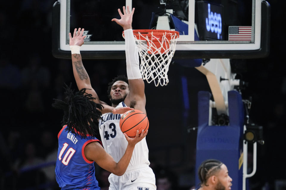 Villanova forward Eric Dixon (43) guards DePaul guard Jaden Henley (10) during the first half of an NCAA college basketball game in the first round of the Big East Conference men's tournament Wednesday, March 13, 2024, in New York. (AP Photo/Mary Altaffer)