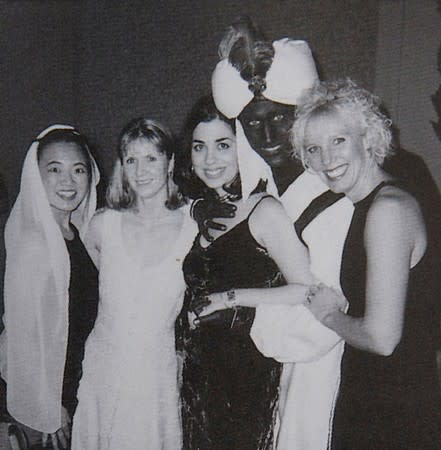 Canada’s Prime Minister Justin Trudeau, with his face and hands painted brown, poses with others during an "Arabian Nights" party