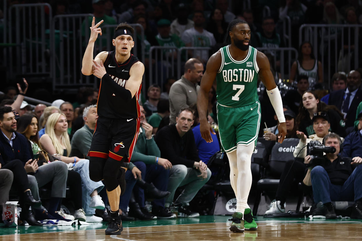 BOSTON, MA - APRIL 24: Tyler Herro #14 of the Miami Heat celebrates a three-point basket as he runs past Jaylen Brown #7 of the Boston Celtics during the third quarter of game two of the Eastern Conference First Round Playoffs at TD Garden on April 24, 2024 in Boston, Massachusetts. NOTE TO USER: User expressly acknowledges and agrees that, by downloading and/or using this Photograph, user is consenting to the terms and conditions of the Getty Images License Agreement. (Photo By Winslow Townson/Getty Images)