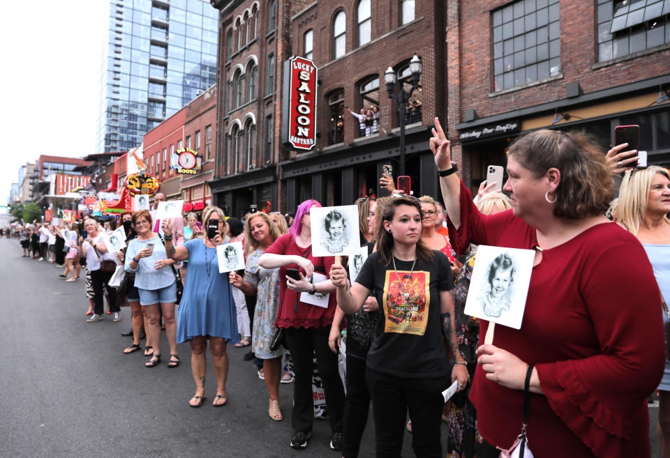 Fans wait outside for the Judd family motorcade after “Naomi Judd: A River Of Time Celebration” at Ryman Auditorium on May 15, 2022 in Nashville, Tennessee. - Credit: Katie Kauss for CMT