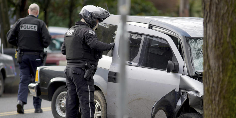 Image: car hits pedestrians (Beth Nakamura / The Oregonian via AP)
