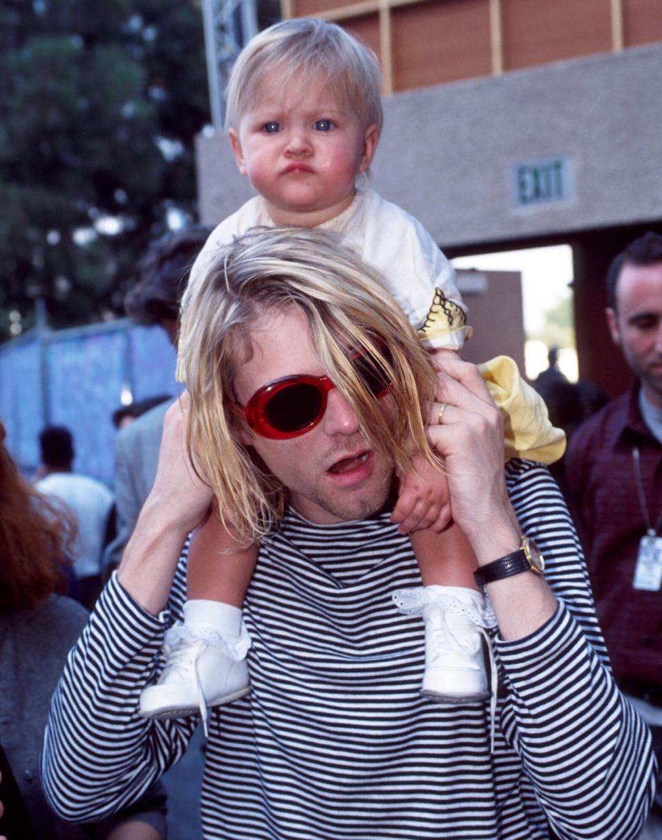 Kurt Cobain of Nirvana and daughter Frances Bean Cobain at the Universal Ampitheater in Universal City, California