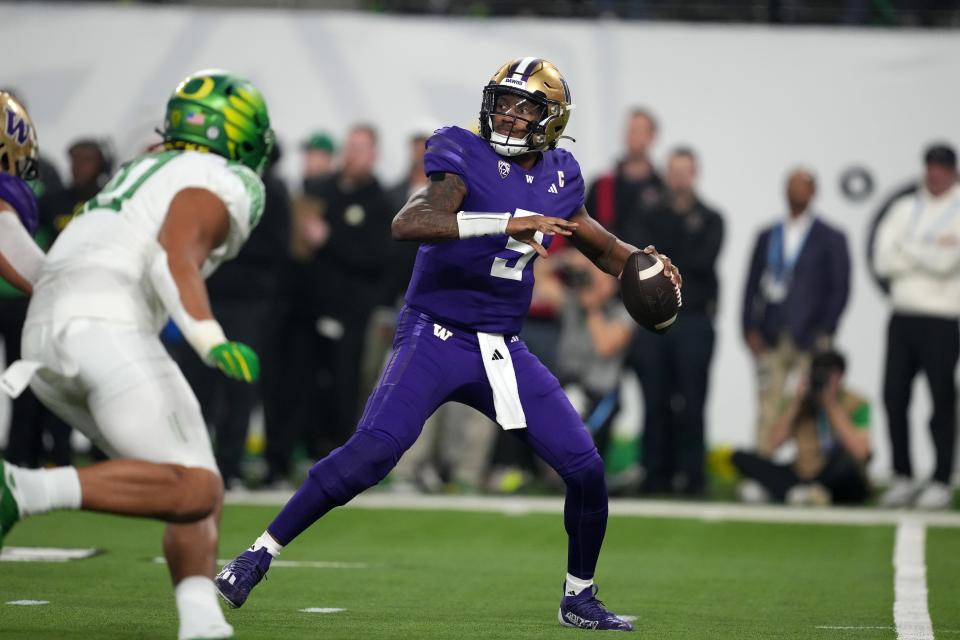 Washington Huskies quarterback Michael Penix Jr. (9) throws the ball against the Oregon Ducks in the first half at Allegiant Stadium Dec. 1, 2023, in Las Vegas.