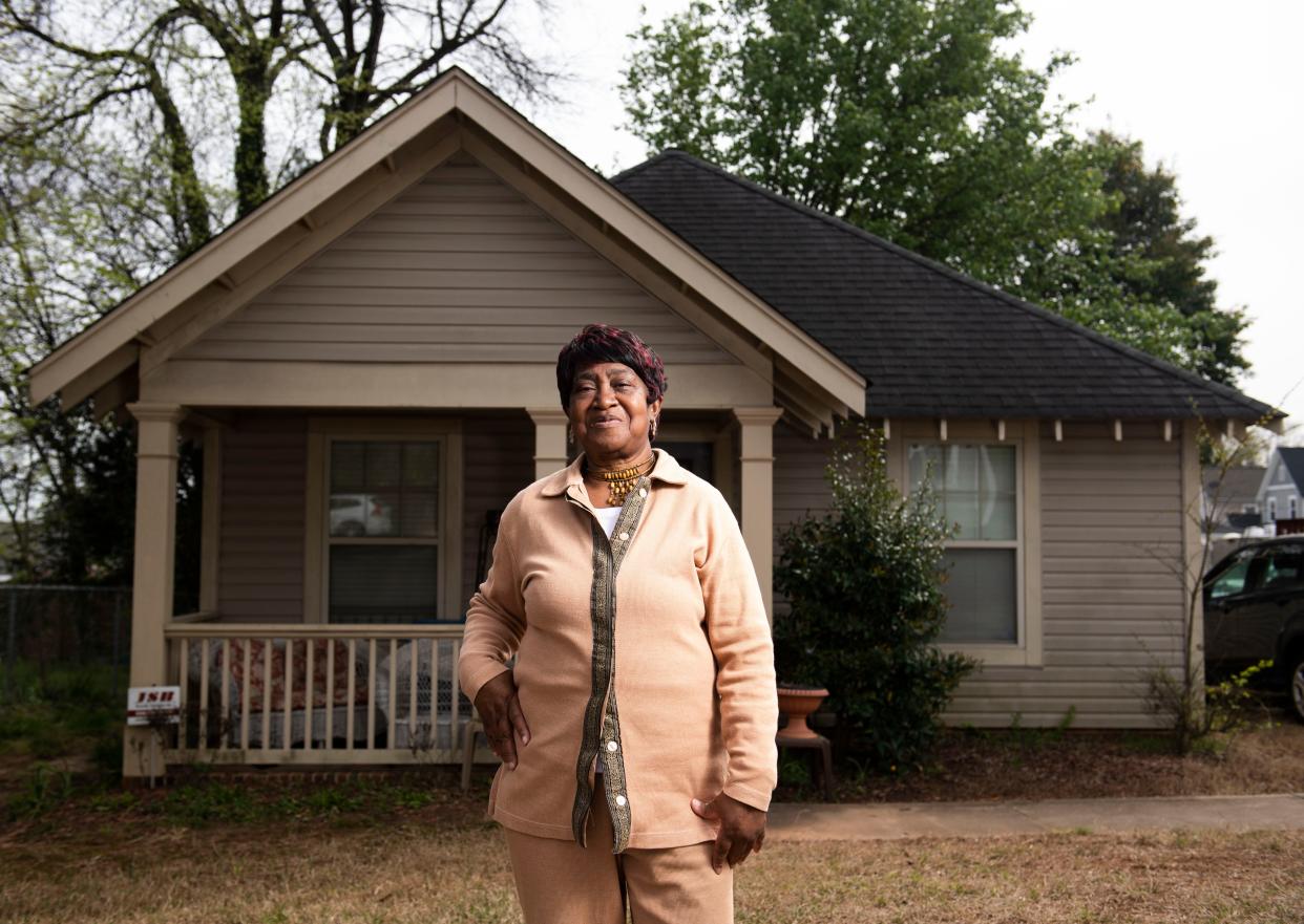 Shirley Gambrell poses for portrait in front of her Greenville home in April. A lifelong resident of Washington Heights, she said her old neighbors were forced out because they were renters who could not afford to buy a house.