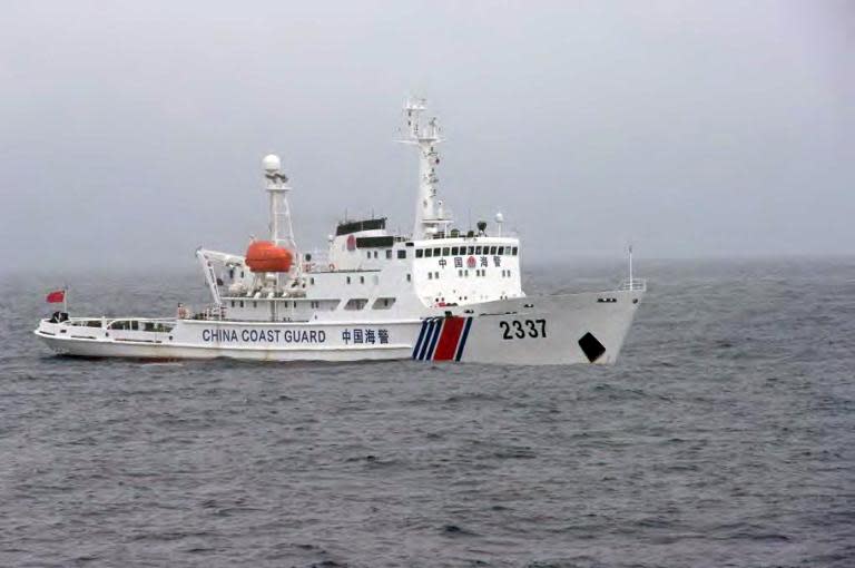 In this file photo, a Chinese Coast Guard ship is seen cruising near the disputed islets known as the Senkaku in Japan and Diaoyu in China, in the East China Sea, on November 2, 2013